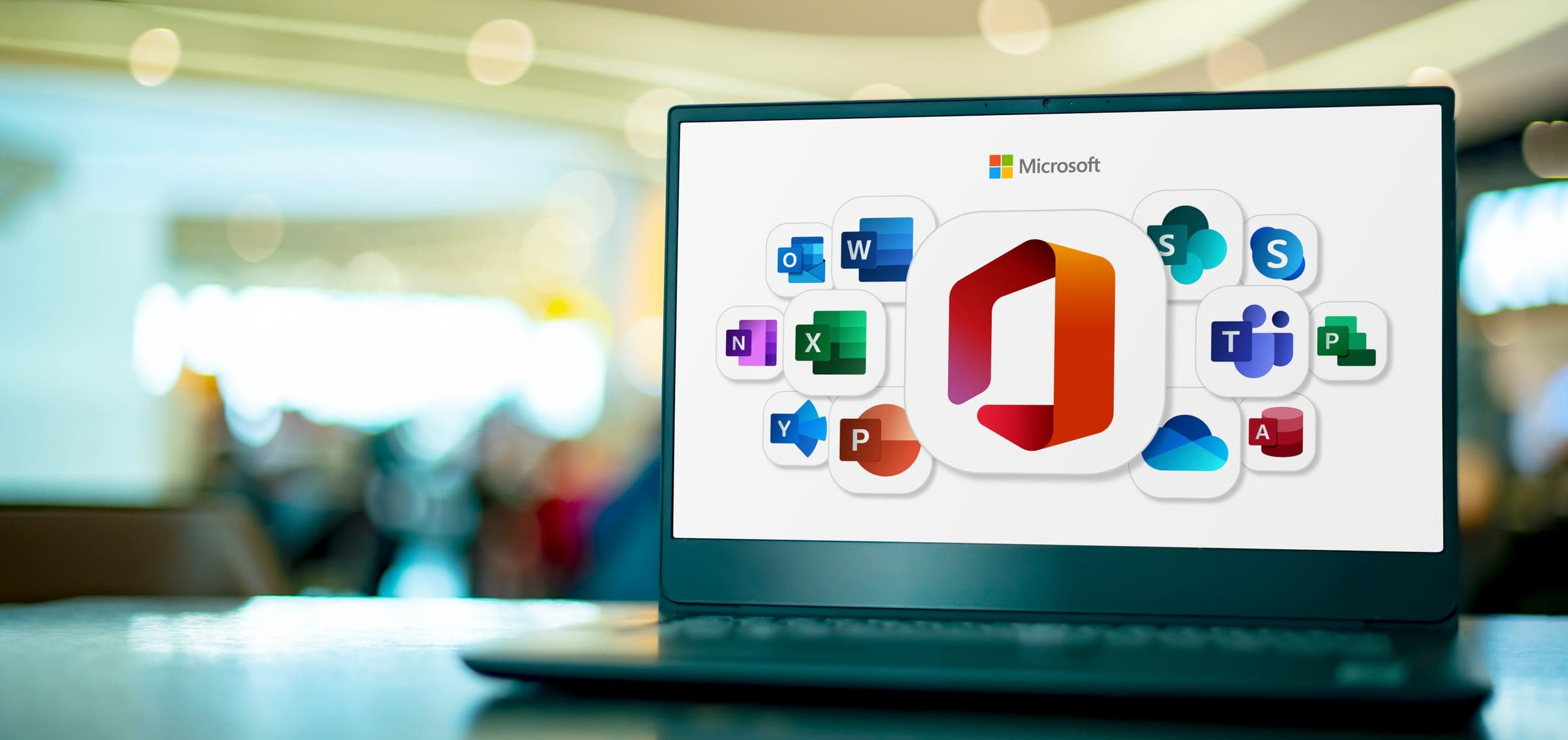 A laptop screen showing the Microsoft 365 app icons
